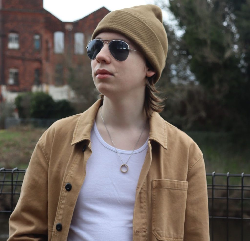 Joe posing in front of an old building.